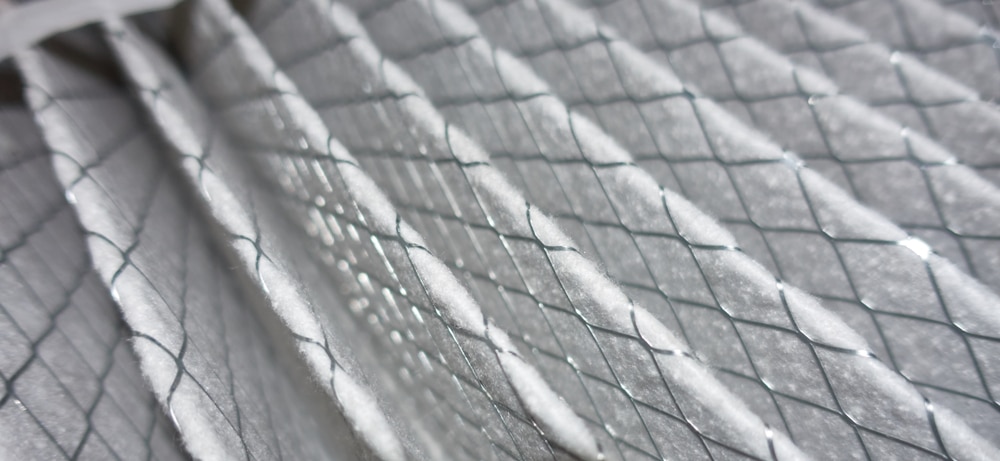 Close up of a white air filter, highlighting the difference between an air purifier and a standard air filter. | High 5 Plumbing, Heating & Cooling